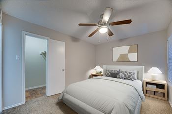Bedroom with a bed, two lamps
